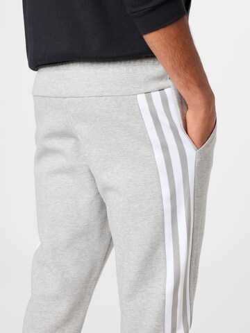 ADIDAS SPORTSWEAR Tapered Workout Pants 'Future Icons 3-Stripes' in Grey