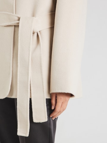 millane Tussenjas in Beige