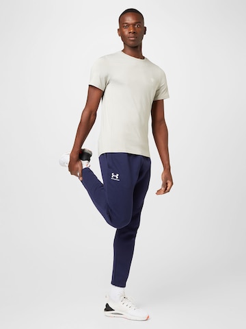 UNDER ARMOUR Tapered Sports trousers 'Essential' in Blue