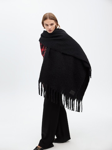 Lola Casademunt Cape in Black: front