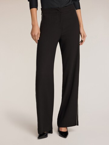 MOTIVI Wide leg Trousers in Black: front