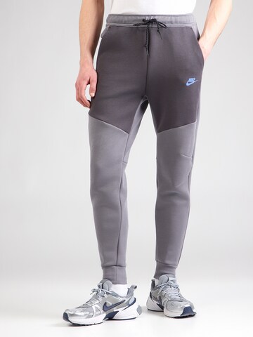 Nike Sportswear Конический (Tapered) Штаны 'TCH FLC' в Серый: спереди
