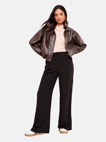 Wide leg Pantaloni di Friends Like These in nero: frontale
