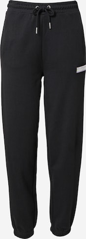 ELLESSE Tapered Pants 'Elhip' in Black: front