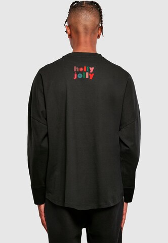 Merchcode Shirt 'Christmas Holly Jolly Mood' in Schwarz