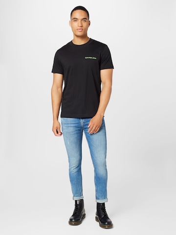 Calvin Klein Jeans T-Shirt in Schwarz | ABOUT YOU