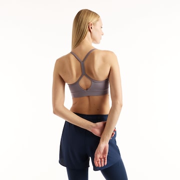 Bustino Reggiseno sportivo 'Essential Yoga Bra' di new balance in grigio