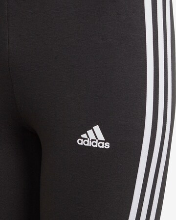 ADIDAS SPORTSWEAR Skinny Urheiluhousut 'Essentials 3-Stripes' värissä musta