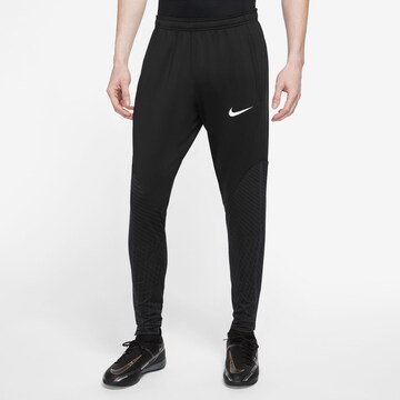 NIKE Slim fit Sports trousers 'Strike' in Black: front