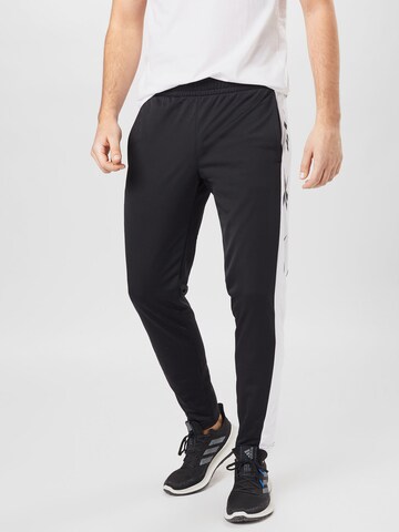 Coupe slim Pantalon de sport Reebok en noir : devant