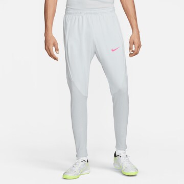 NIKE Slim fit Workout Pants in Grey: front