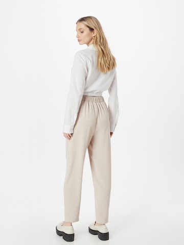 ABOUT YOU Loose fit Pleat-Front Pants 'Nicole' in Beige