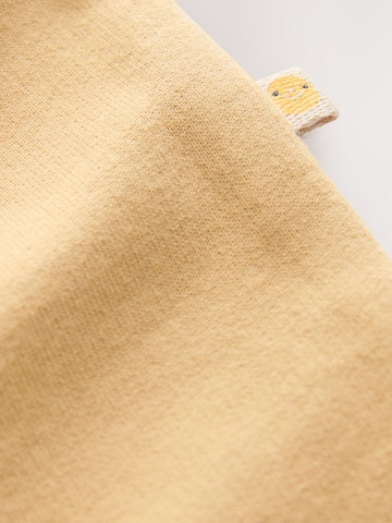 Tutina / body per bambino di Next in beige