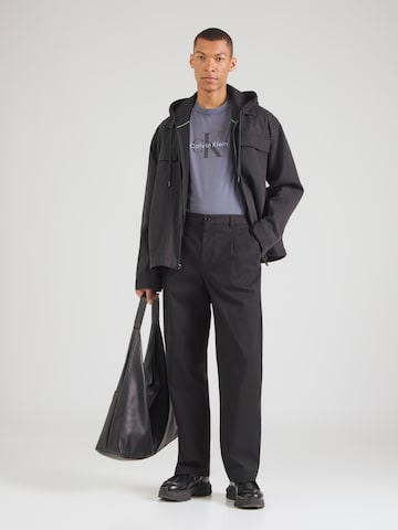 Calvin Klein Jeans Voľný strih Plisované nohavice - Čierna