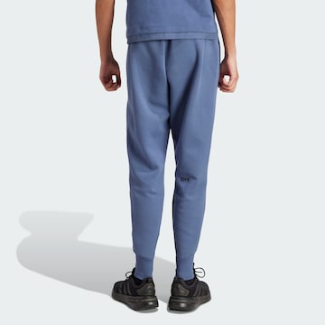 ADIDAS SPORTSWEAR Дънки Tapered Leg Спортен панталон 'Z.N.E. Premium' в синьо