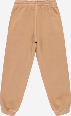Calvin Klein Jeans Zwężany krój Spodnie w kolorze pomarańczowy