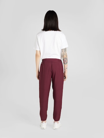 NIKE Tapered Sports trousers 'FLSH CHLLGR' in Red