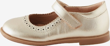 Next - Bailarina en oro: frente