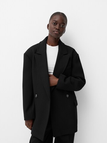 Bershka Between-seasons coat in Black: front