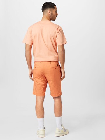 oranžinė Dockers Prigludęs „Chino“ stiliaus kelnės
