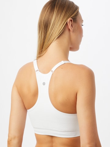 Athlecia Bustier Urheilurintaliivit 'Lotus' värissä valkoinen