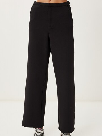 Happiness İstanbul Loose fit Trousers in Black: front