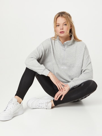 Sweat de sport aim'n en gris