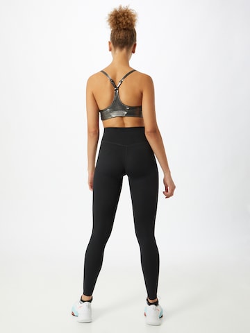 NIKE Skinny Športne hlače 'One Luxe' | črna barva