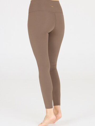 Athlecia Skinny Sports trousers 'Snyder' in Brown
