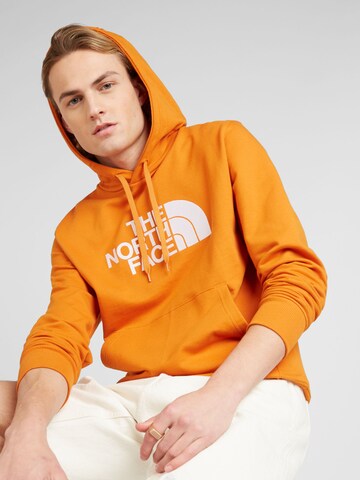 THE NORTH FACE - Sudadera en naranja