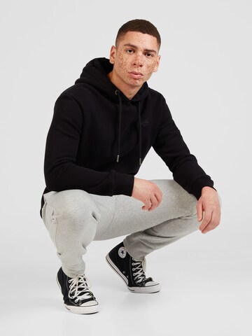 Superdry Sweatshirt 'ESSENTIAL' in Zwart