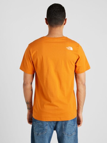 THE NORTH FACE Тениска 'MOUNTAIN LINE' в оранжево