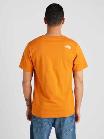 THE NORTH FACE - Camiseta 'MOUNTAIN LINE' en naranja