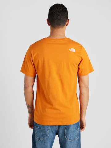 Tricou 'MOUNTAIN LINE' de la THE NORTH FACE pe portocaliu