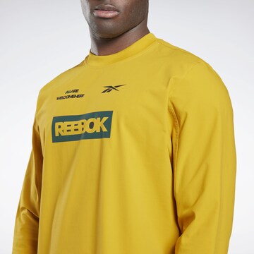 Reebok - Camiseta funcional en amarillo