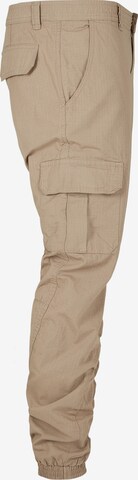 Tapered Pantaloni cu buzunare de la Urban Classics pe bej