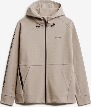 Veste de survêtement Superdry en beige : devant