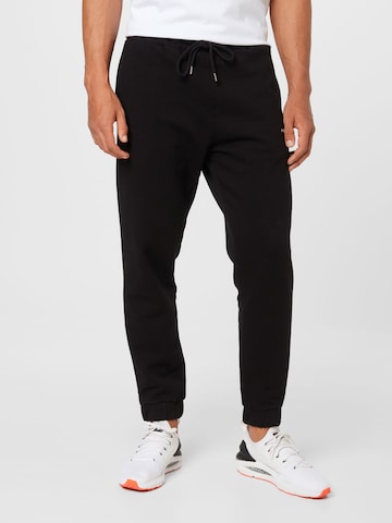 Pegador - Tapered Pantalón en negro: frente