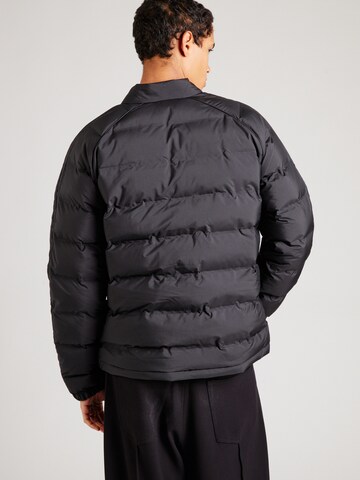 ADIDAS ORIGINALS - Chaqueta de entretiempo en negro
