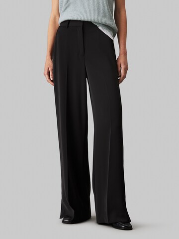 Calvin Klein Wide leg Pleat-front trousers in Black: front