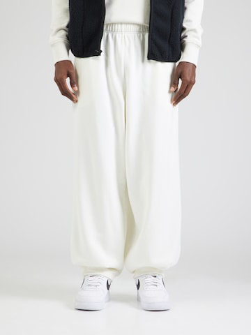 Nike Sportswear Tapered Pants 'CLUB' in Beige: front