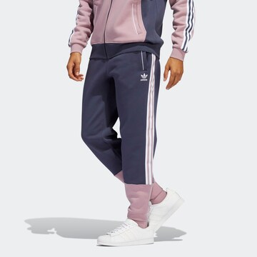 Tapered Pantaloni di ADIDAS ORIGINALS in blu