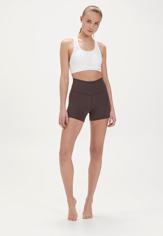 Athlecia Slim fit Sports trousers 'ALMY W' in Brown