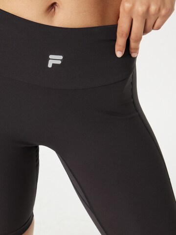 Skinny Pantaloni sportivi 'RAKANDA' di FILA in nero