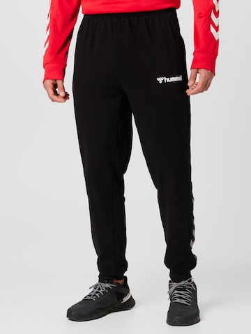 Hummel Zwężany krój Spodnie sportowe w kolorze czarny: przód