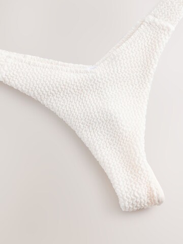 Slip bikini di self. in beige