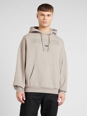 ABOUT YOU Sweatshirt 'Malik Hoodie' in Beige: voorkant