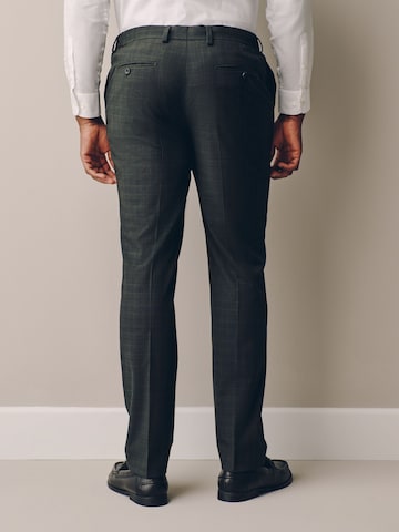 Slimfit Pantaloni con piega frontale 'Motionflex' di Next in verde