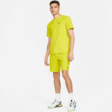 NIKE Regular Workout Pants 'Totality Pro' in Yellow