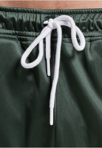 Loosefit Pantaloni sportivi 'DMWU Evolution' di Unfair Athletics in verde